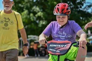 tri my best biker in red helmet smiles