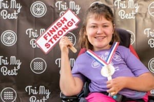 tri my best participant holds finish strong sign