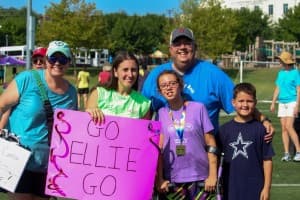 tri my best participant Ellie poses with family