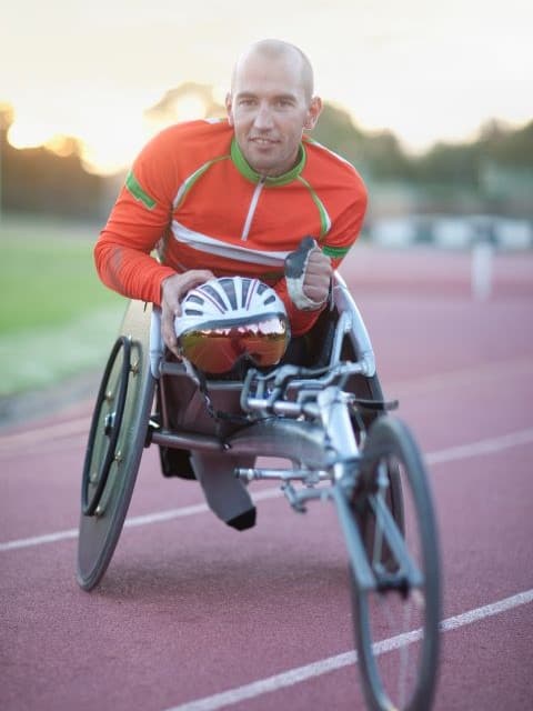 Tri My Way biker poses after race on adaptive bike