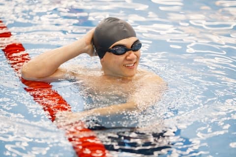 Tri My Way swimmer rests in pool lane